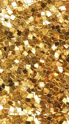 a close up view of gold colored glass mosaic tiles