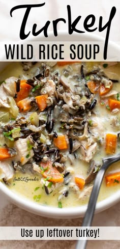 a bowl of turkey wild rice soup with carrots and celery