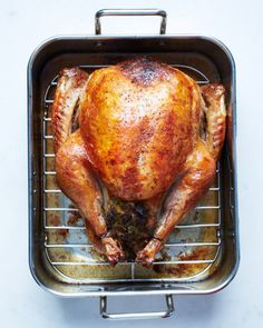 a whole chicken sitting on top of a metal rack