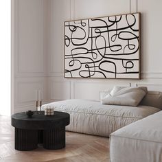 a living room with two couches and a coffee table in front of a painting on the wall