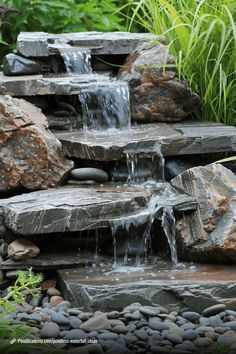 a small waterfall in the middle of some rocks