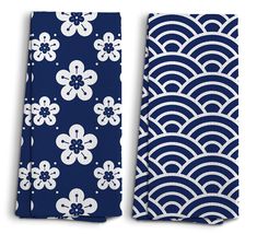 two pieces of blue and white fabric with flowers on them, one in the shape of waves