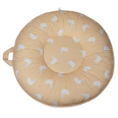 an image of a round cushion with ducks on the front and back, in beige