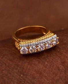 Princess cut gems adorned ring. Made from brass, two tone plated and a good match for formal outfits. \nColour: Gold, White \nSurface Finish: Embellished \nTheme: Classic \nDesign: Geometric \nMaterial: Brass \nDesign Width: 0.75 mm \nDesign Length: 0.25 mm \nGross Weight: 4.38 gms \nGold Weight: 4.38 gms #ring#white#design#gold#color#2022#newyear2022 Gems Ring, Embrace Yourself, Jewellery Women, Women Jewellery, Wedding Function, Gem Ring, Formal Outfits