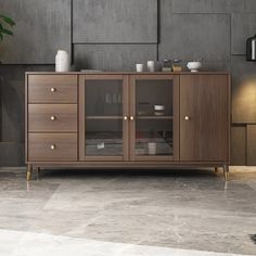 a large wooden cabinet with glass doors and drawers in a living room or dining room