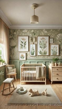 a baby's room with green walls and pictures on the wall