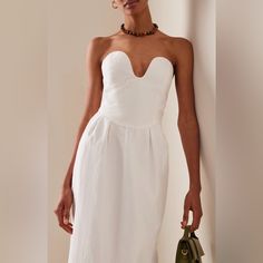 Elegant, Seductive & Flattering, The Gorgeous Isla Dress By Mara Hoffman Is The Perfect Choice To Dazzle At Summer Weddings Or Wear On Your Next Vacation. The Slim Strapless Midi Dress Accentuates All Your Curves With A Deep Sweetheart Neckline, Curved Waist Seam With Pleating & Slender Column Skirt. Wear It With A Beaded Necklace & Sling Back Heels Or For An Effortlessly Chic Look. Featuring An Invisible Back Zipper & Center Back Slit. Sustainably Made With 63% Tencel Lyocell, 37% Linen. Fully Mara Hoffman Dress, Sling Back Heels, Midi Dress White, Column Skirt, Strapless Sweetheart Neckline, Posh Party, Strapless Midi Dress, Button Front Dress, Mara Hoffman