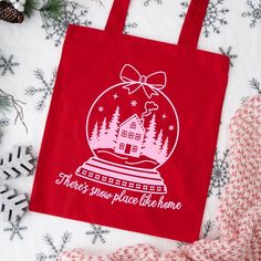 Snow Globe with Bow Snow Place Like Home Free SVG File on Red Tote Bag