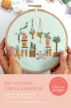 someone is holding up a cross stitch pattern to show how to make the glasshouse