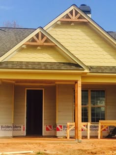 a house under construction with the front door open