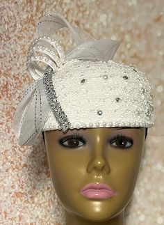 Simple, yet elegant. White lace Fascinator half hat trimmed with pearls, rhinestones, and bow. The hat is affixed to the head via a hatstring. The hat's circumference measures approximately 22.5 inches. (hat size 22.5 inches) PLEASE NOTE All items for Free Shipping will be shipped via USPS First Class Mail. Elegant Curved Brim Headpiece For Ceremony, Elegant Wedding Hats With Satin Bow, Elegant Costume Hats For Ceremonies, Elegant White Costume Hats For Ceremonies, Elegant Hat With Satin Bow For Party, Elegant Curved Brim Ceremony Headpiece, Elegant Ceremony Hat With Short Brim, Elegant Party Hat With Satin Bow, Elegant Short Brim Fascinator For Ceremonies