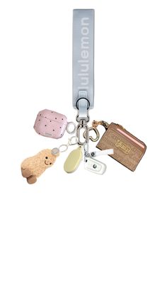 a keychain with several different items attached to the lanyard, including an animal and name tag