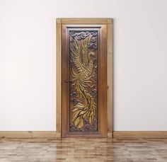 an open door in a room with wood flooring and white walls is decorated with intricate designs