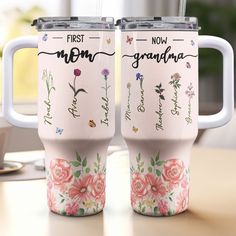 two personalized coffee mugs sitting on top of a wooden table next to each other