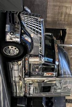 a large semi truck parked next to a building