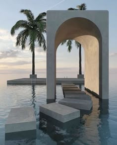 there are some steps in the water near an arch and palm trees on the other side