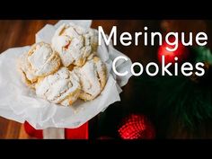 a red box filled with cookies on top of a wooden table