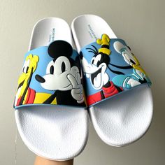 An Adorable Brand New / Never Before Used Disney : Mickey And Friends - Slip-On Sandals Great For Adding To Your Shoe Collection! Size : 7/8 Mint Condition | Disney Exclusive | Limited Edition | Plastic Material ( Sold Out In Stores / Online ) I Usually Ship Out My Packages Within 2-3 Business Days. If There Are Any Delays Due To My Schedule, I Always Make Sure To Let My Customers Know! All Sales Are Final | No Returns If You Have Anymore Questions, Please Feel Free To Message Me At Anytime! Fun Round Toe Slides For Vacation, Playful Non-slip Synthetic Slides, Cartoon Style Open Toe Beach Sandals, Cute Synthetic Flat Slides, Cartoon Style Sandals For Beach And Summer, Cartoon Style Sandals For Beach In Summer, Cartoon Style Summer Beach Sandals, Playful Synthetic Slides For Spring, Fun Non-slip Synthetic Slides