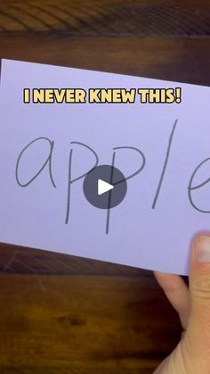 someone holding up a note that says i never knew this apple