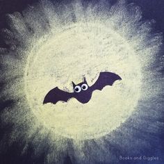 a drawing of a bat with googly eyes on it's face in the sky