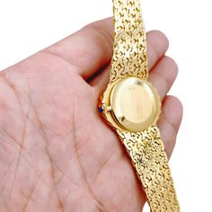 Ladies Corum 26mm x 30mm Oval Vintage 18K Yellow Gold Watch with Gold Dial and Weave Bezel. Pre-Owned SN# 163**** Brand: Corum. Dial Color: Gold. Type: Wristwatch. Gender: Women's. Condition: Excellent. Bezel: 18K Yellow Gold. Total Weight: 62 Grams. Case Size: 26mm x 30mm. Movement: Quartz (Battery). Band Material: 18K Yellow Gold. Bezel Material: 18K Yellow Gold. Bracelet Size: Fits 6.5" to 6.75" Wrist. Warranty: One (1) Year Limited Service Warranty. Formal Oval Diamond Watch With Diamond Hour Markers, Oval Diamond Watch For Formal Occasions, Formal Oval Diamond Watch, Oval Quartz Watch For Formal Occasions, Yellow Gold Oval Watch For Gift, Oval Yellow Gold Watch As Gift, Gold Oval Watches As Gifts, Gold Oval Watches For Gift, Oval Yellow Gold Watches For Gifts