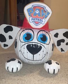 a dalmatian pumpkin with the words paw patrol painted on it