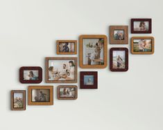 a group of wooden framed pictures hanging on the wall next to each other with family photos in them