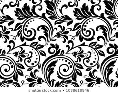 an ornate black and white wallpaper pattern with swirls, leaves and flowers on it