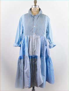 Each one-of-a-kind dress is made from upcycled men's shirts, creatively utilizing plackets, cuffs, and buttons as design elements. Our goal is to minimize waste and maximize style, and Johanna expertly combines the patterns and stripes in each bespoke garment for a fresh and unique look. As the song goes, everything old is new again! One-Of-A-Kind Upcycled Handmade 100% Cotton Machine or Hand Wash Sizing: Each shirt dress reflects the oiginal garments they were created from. They are cut to flatter a variety of body types and come in three general size ranges (1, 2 and 3) [Please note this is NOT your standard dress size]. We provide specific measurements to help you choose the perfect dress for you. Size Range: 2 Shoulder Width: 17 inches Empire: Drop: 11 inches Empire Width: 23 inches Le Upcycle Mens Dress Shirt For Women, Upcycle Mens Dress Shirt, Upcycled Shirt, Waste Clothing, Shirt Makeover, Recycled Shirts, Upcycled Dress, Upcycle Clothes Diy, Upcycle Shirt