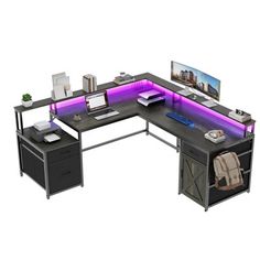 an l shaped desk with purple lights on it