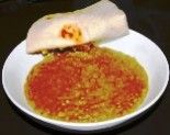 a white plate topped with food on top of a table