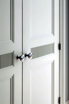 an open door with two knobs on it