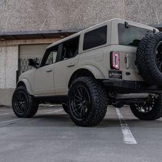 an off - road vehicle parked in a parking lot