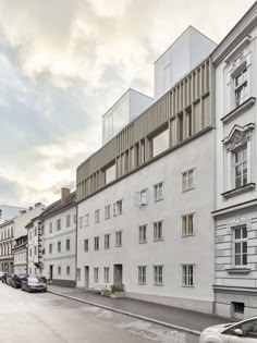 an apartment building with many windows and balconies