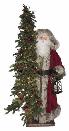 a statue of santa claus holding a christmas tree with lights on it's sides