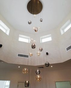 a large chandelier hanging from the ceiling in a room