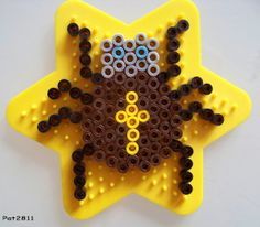 a star shaped object made out of plastic beads