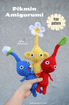 three crocheted stuffed animals in the shape of giraffes and an elephant