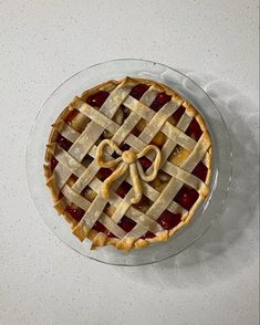 a pie sitting on top of a glass plate