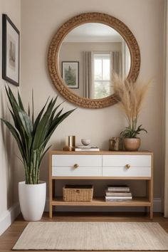 a living room with a plant and mirror