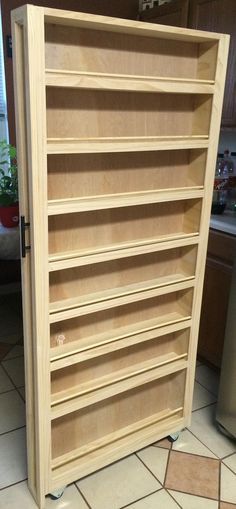 a large wooden cabinet with many shelves in it