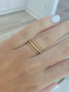 Add this delicate beaded design 14K gold band to any finger --- it is easiest ring to layer into your everyday jewelry routine! Delicate 14k Yellow Gold Bands, 14k Gold Filled Fine Jewelry Stackable Rings, Dainty 14k Gold Stackable Rings, Dainty Yellow Gold Stackable Rings With Simple Design, Delicate Yellow Gold Stackable Rings With Simple Design, Dainty 14k Gold Filled Yellow Gold Rings, Delicate Adjustable 14k Gold Diamond Ring, Delicate Gold 14k Band, Adjustable Delicate 14k Gold Diamond Ring