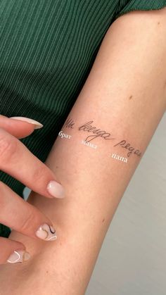 a woman's arm with the words happy new year written in cursive writing on it