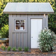 an image of a small shed in the yard with trees and shrubs around it on instagram