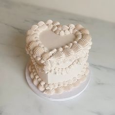 a heart shaped cake sitting on top of a table