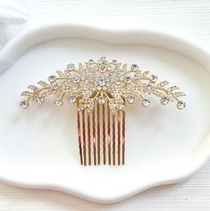 Beautiful floral gold crystal on gold hair comb. Add a touch of elegance to your outfit with this stunning leaf shape hair comb. The gold sparkling crystals makes the perfect accessory for a formal occasion.  The hair comb style makes it comfortable  to wear all day long. Make your special day memorable with this gorgeous comb.  One size fits all Measurement: length , width cm Ship with Royal Mail. Next day delivery also available at checkout. Thank you for visiting my shop. Gold Hair Comb, Hair Comb Bridal, Women Hair Accessories, Wedding Gold, Gold Crystal, Gold Hair, Sparkling Crystal, Leaf Shapes, Measurement Length