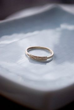 This handmade 14K yellow gold band (1.5 x 1 mm)  is adorned with a 14k gold floral piece. The gold portion has a beautiful pattern that reminds me of the delicate blue forget-me-not flowers. This ring can serve as a reminder of all the lovely memories and love.Fun fact: In 15th-century Germany, it was supposed that the wearers of the flower would not be forgotten by their lovers. Legend has it that in medieval times, a knight and his lady were walking along the side of a river. He picked a posy Medieval Times, Gold Floral, Forget Me Not, Fun Fact, Gold Band, Beautiful Patterns, Gold Bands, Wedding Rings Engagement, Wedding Engagement