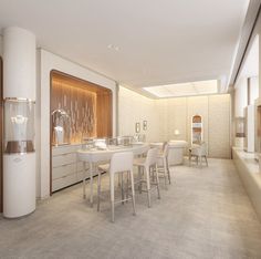 a dining room filled with white furniture and tall windows