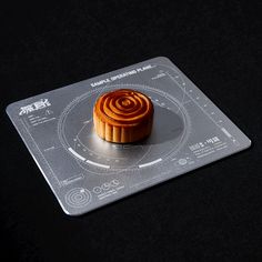 a small pastry sitting on top of a plastic coaster