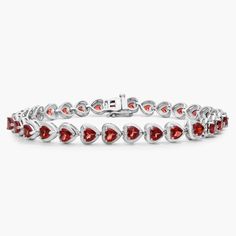 Vividly red heart-shaped garnets sparkle gorgeously along the length of this elegant bracelet, giving it a romantic effect. Elegant Red Sterling Silver Bracelet, Valentine's Day Garnet Heart Jewelry, Heart-shaped Garnet Jewelry As Gift, Heart-shaped Garnet Jewelry For Gift, Heart-shaped Garnet Jewelry For Valentine's Day, Garnet Heart, Elegant Bracelet, Heart Bracelet, Gemstone Bracelets